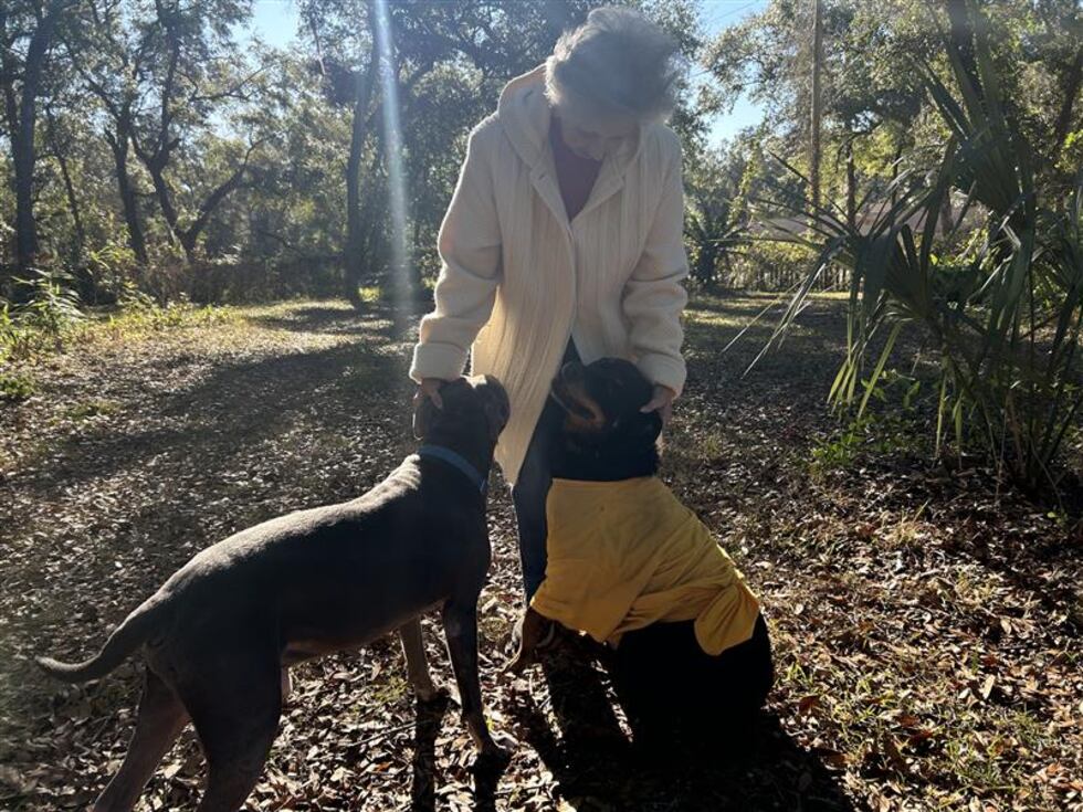 Buie with her two dogs, Shadow and Grayson.