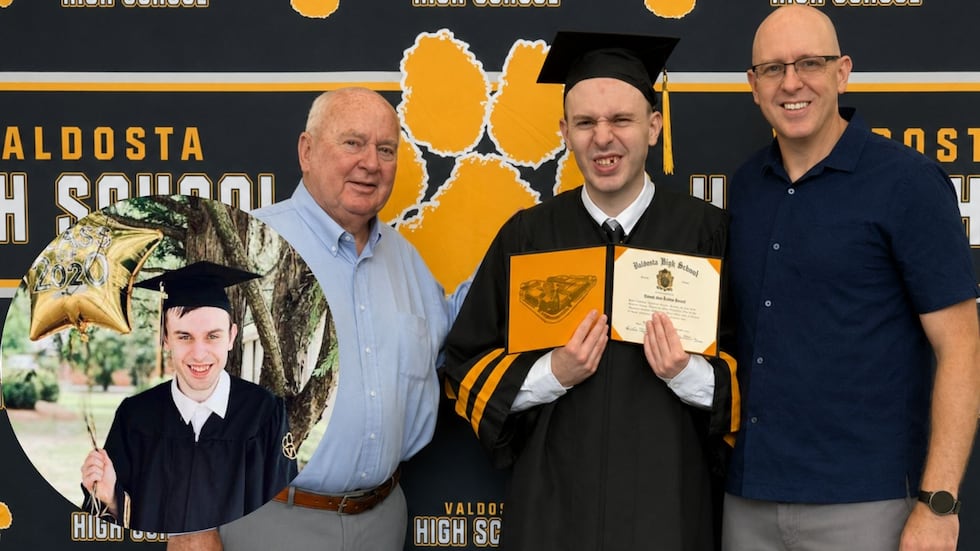 Autistic Georgia student walks across the graduation stage after 5 years of fighting for the chance