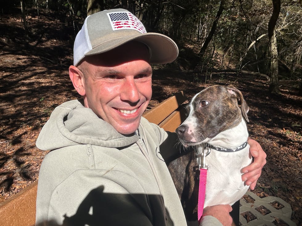 Bailey looks at her owner, Brian, with big loving brown eyes.